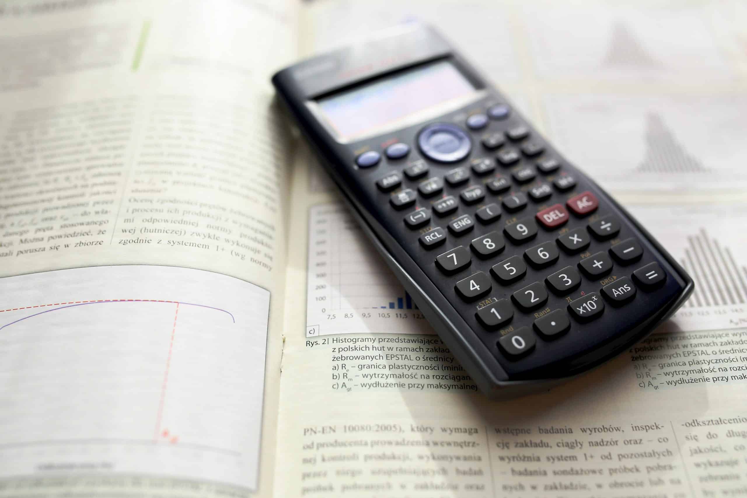 calculator sitting on a book.
