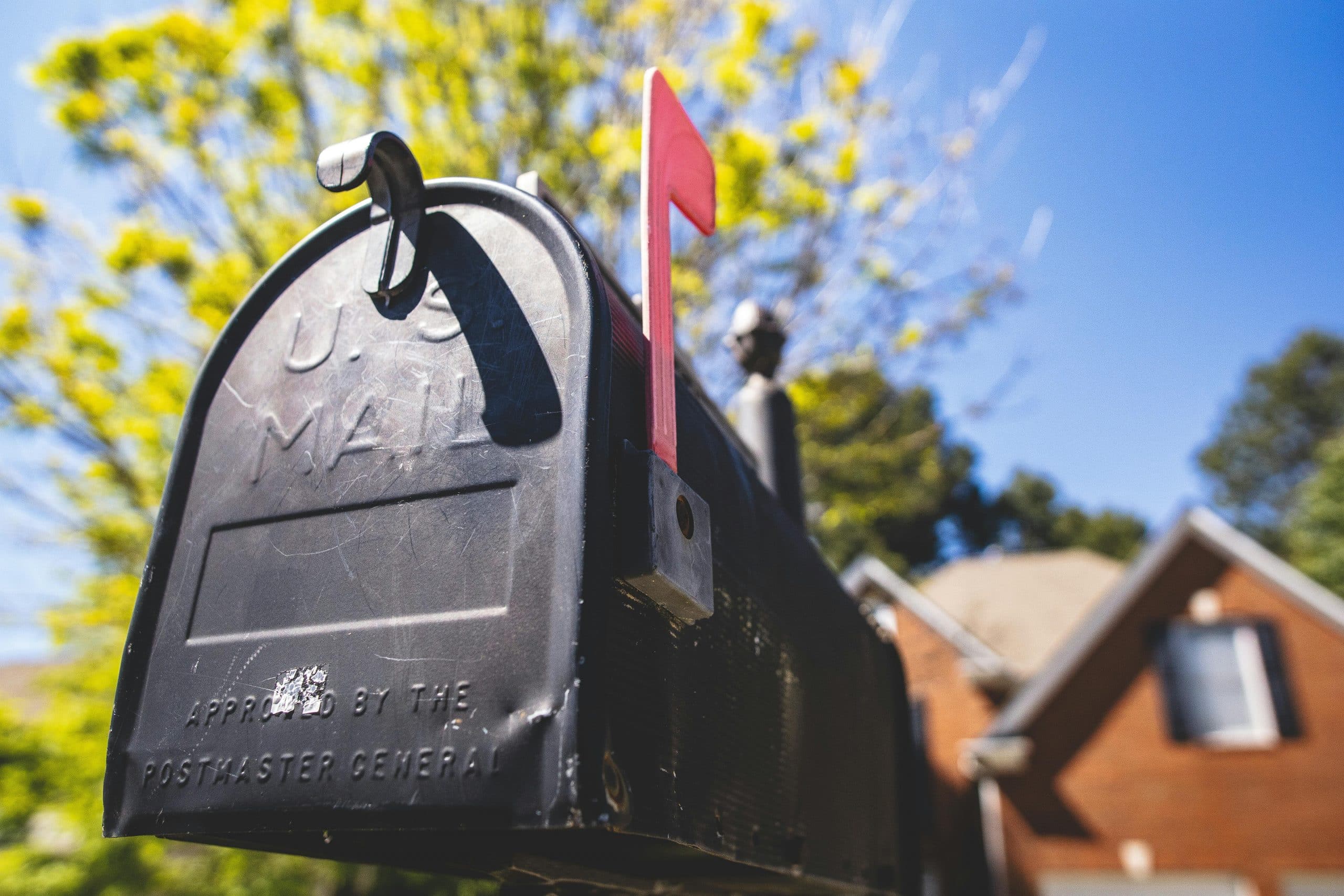 Mailbox with red flag raised.