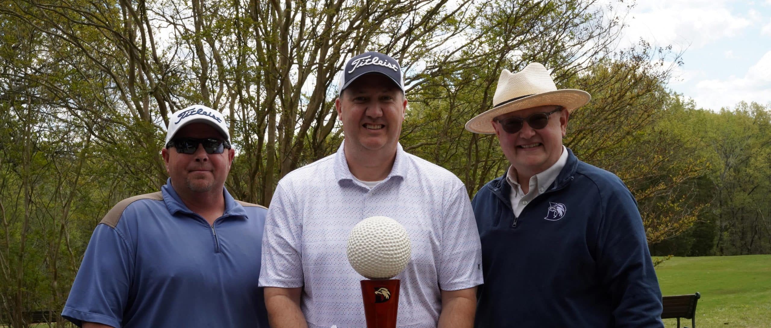 Winners of the Henry County Golf Tournament standing with Dr. Scott Cook.