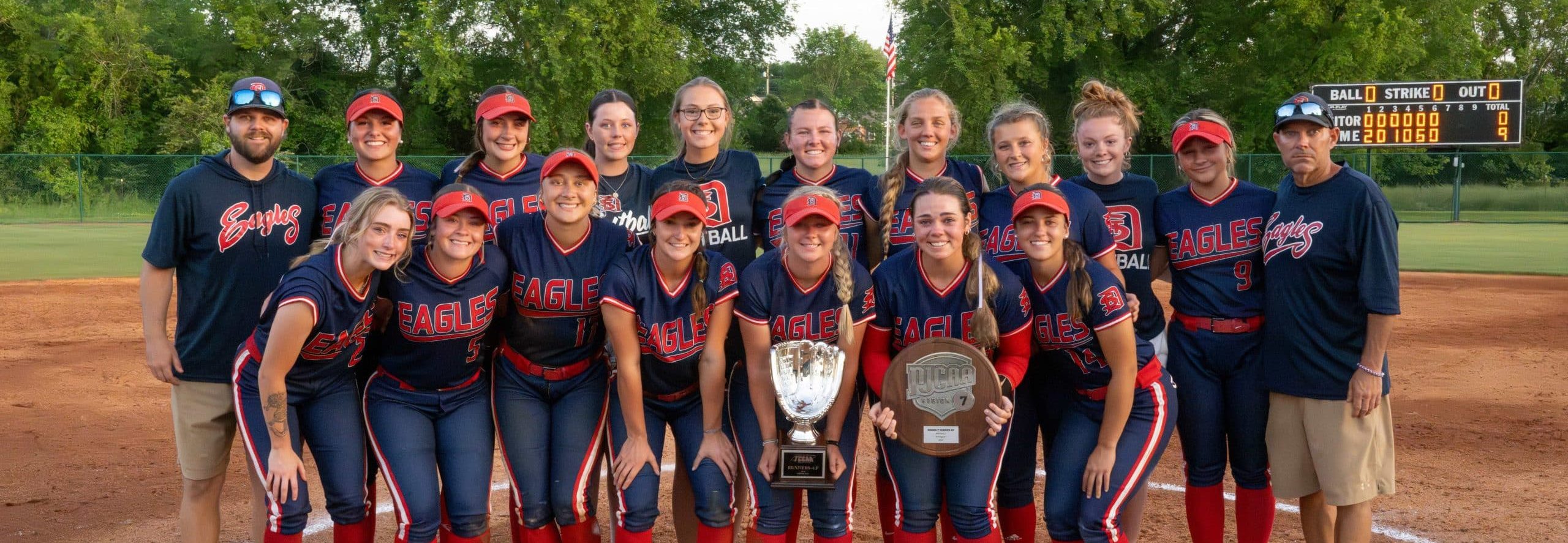 Softball team with 2 trophies.